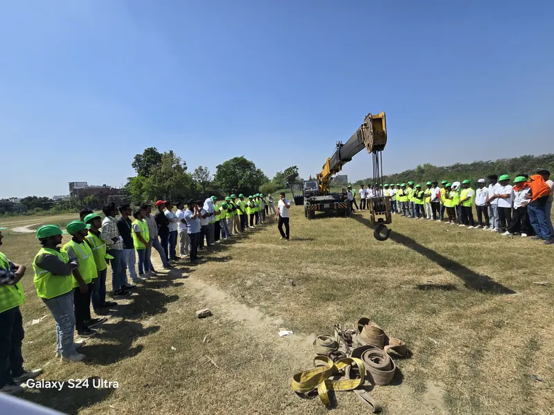Students observing a mobile crane